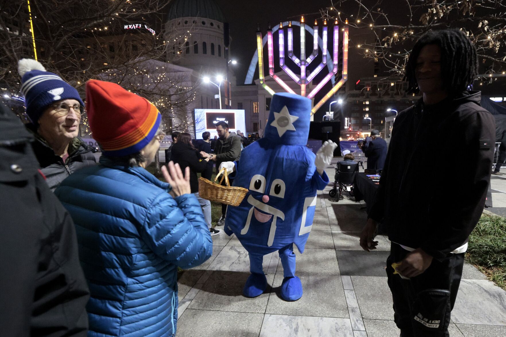 About two dozen people attend Night 6 of Chanukah Menorah Lighting